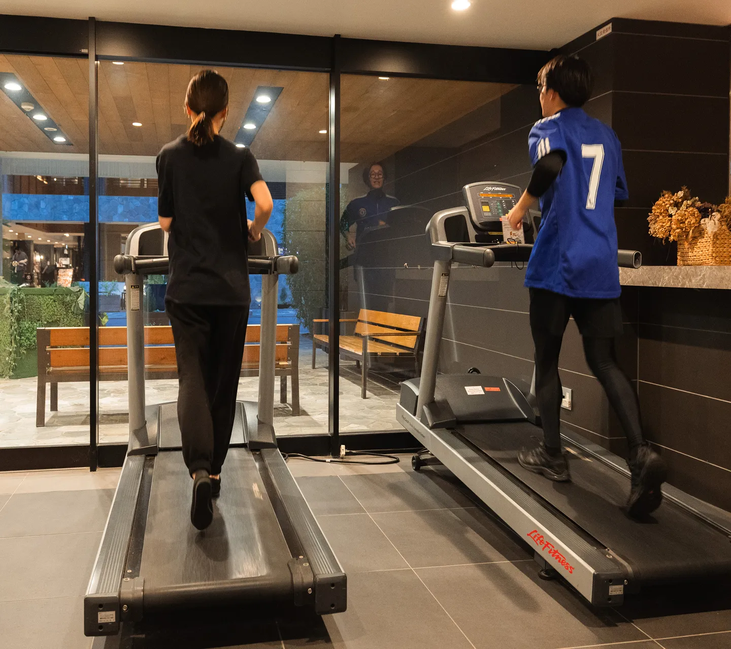 Guest working out on a treadmill in the fitness area