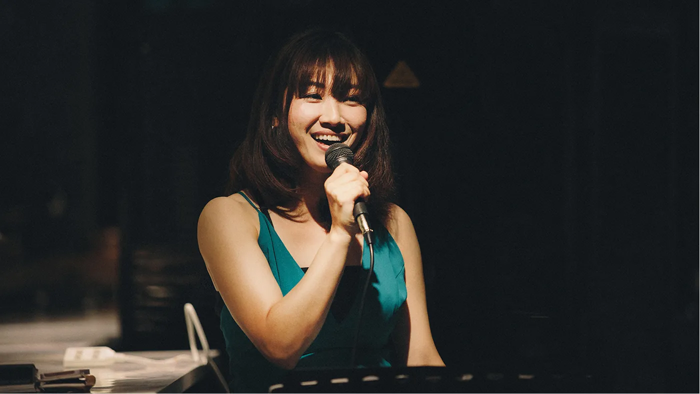 Vocalist singing into a microphone